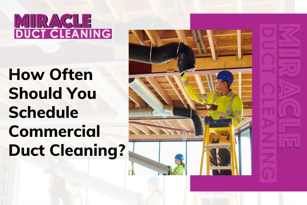 Technician performing commercial duct cleaning in office